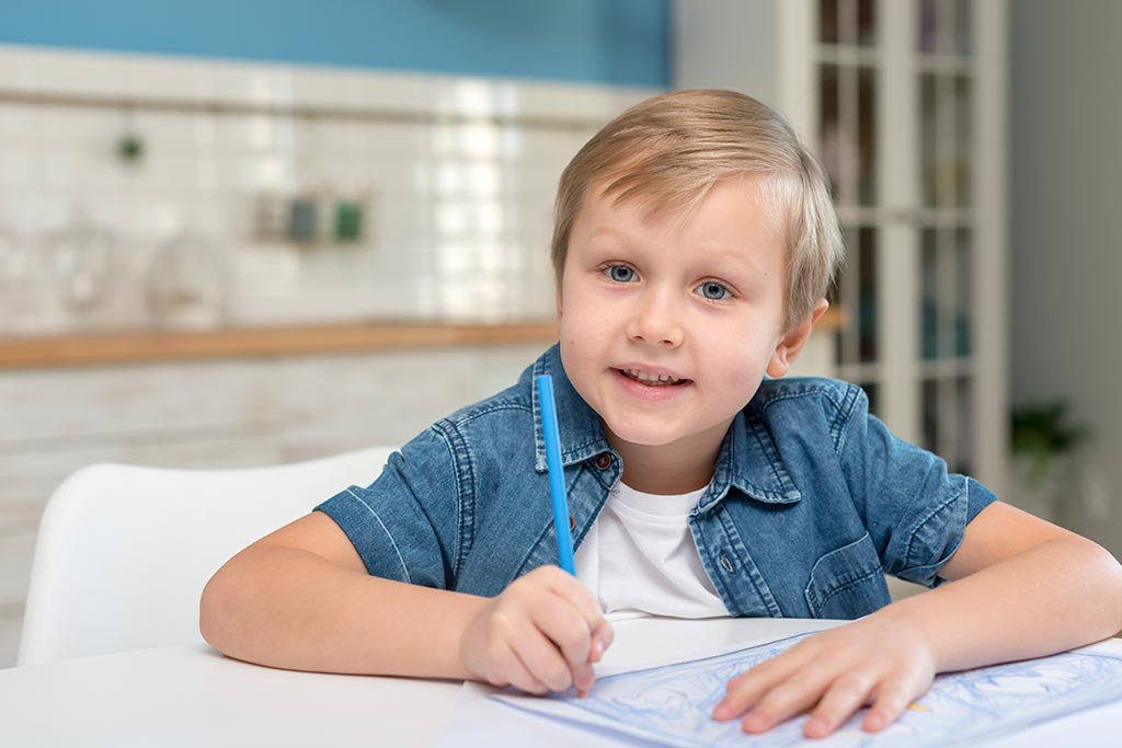 Child At Home Writing In Journal