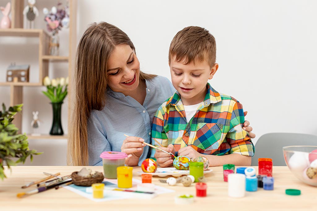 Young Mom Painting With Son