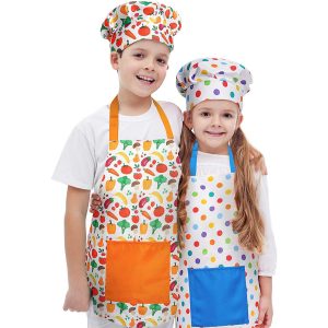 Boy And Girl Wearing RiseBrite Polka Dot And Vegetable Aprons And Chef Hats
