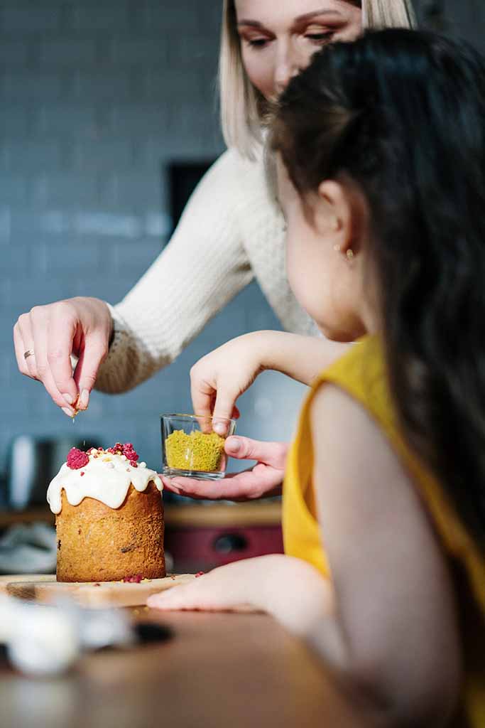 Mother and Girl Baking And Decoration Cake