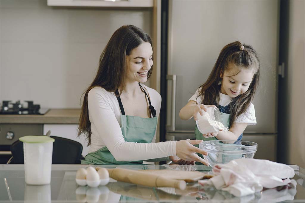 Mother And Daughter Baking Together