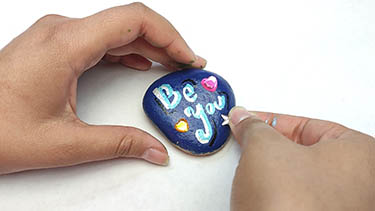 Kindness Rock Painting Tutorial Step 10: Embellish With Shiny Gem Stickers