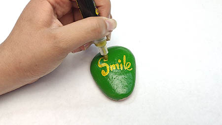 Kindness Rock Painting Tutorial Step 2: Drawing Text With An Acrylic Paint Marker