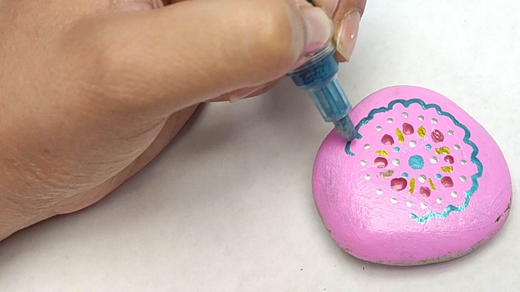 Mandala Rock Painting Tutorial Step 18: Make Circular, Flower Like Patterns Surrounding The Dots