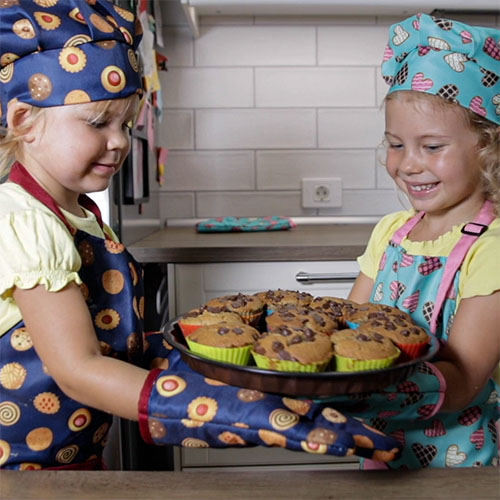 Girls In Aprons Baking Cookies