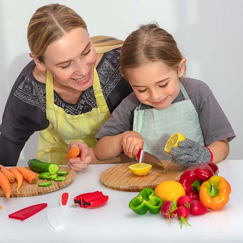 RiseBrite child safe knife set includes 1 stainless steel kid's knife with safety cover, plastic knife for kids, peeler, sharpener, and protective glove. These kids kitchen tools allow children to fully immerse themselves in an off-screen cooking experience. Beam with pride as they grow confident in their abilities.